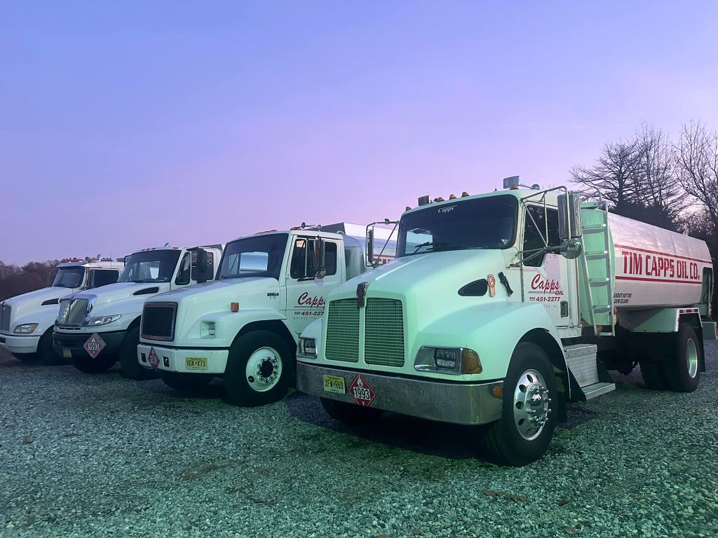 Tim Capps Fuel Oil Co. delivery trucks at dawn — South Jersey fleet
